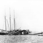Schooner AETNA trying to salvage the schooner ALICE E. CLARK at Long Island Ledge off off Islesboro, Maine.